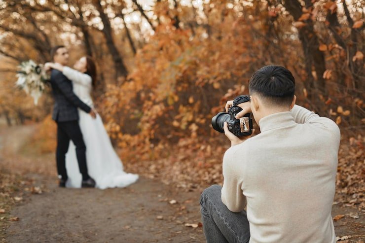 professional wedding photographer taking pictures bride groom
